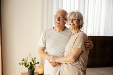 Smiling,Senior,Couple,In,Love,Hugging,At,Nursing,Home,And