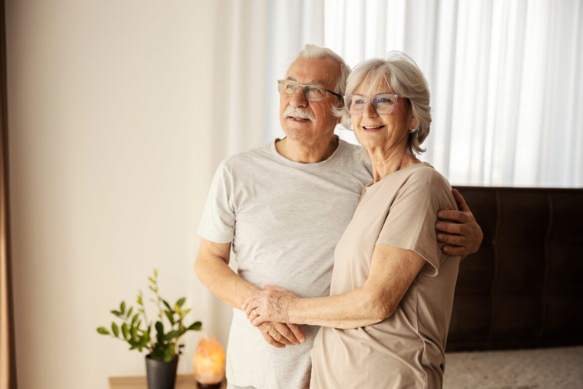 Smiling,Senior,Couple,In,Love,Hugging,At,Nursing,Home,And